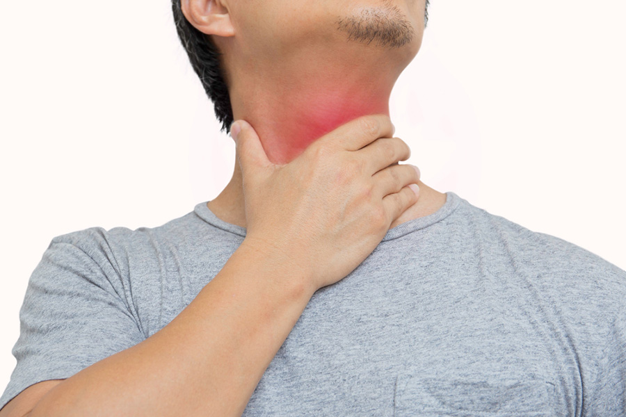 man having sore throat touching his neck islated clipping path coronavirus symptom