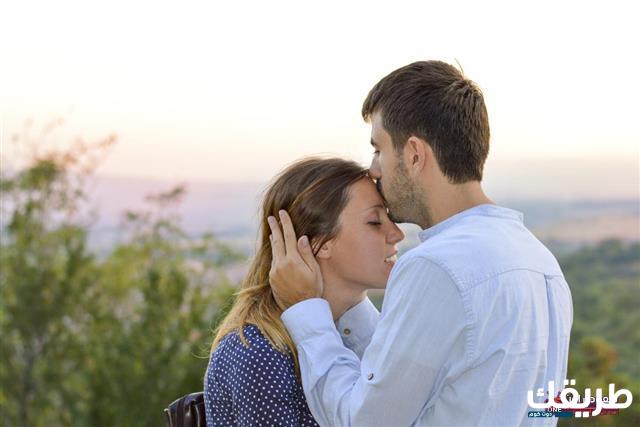 640 486474634 man kissing woman on forehead