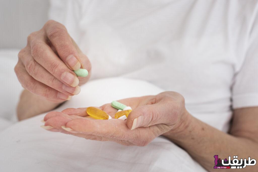 person holding many colorful pills 1024x683 1